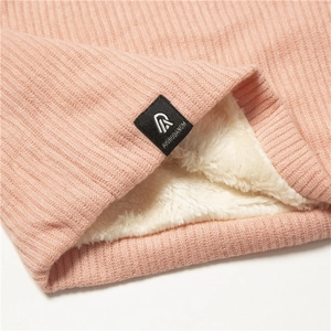 Detail of pink ribbed knit neck warmer with thick white fleece lining for winter warmth