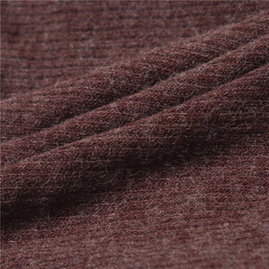 Close-up of dark red knitted neck warmer featuring soft faux fur lining and ribbed texture