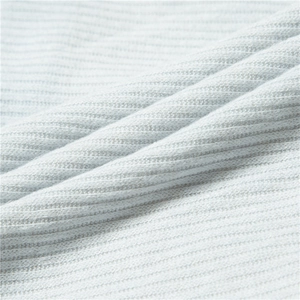 Close-up of light blue rib-knit fabric texture with soft fleece lining for winter warmth