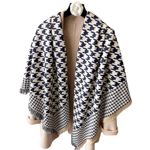 Thick houndstooth scarf wrap with tassels for winter fashion on neutral coat