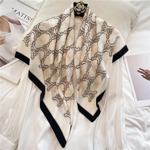 Elegant 90x90cm square silk scarf featuring luxury monogram pattern with black borders