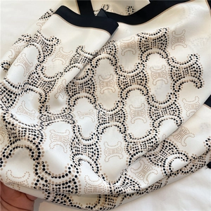 Detailed view of striped silk square scarf with classic pattern and black border