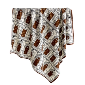 Elegant silk scarf with architectural patterns and floral motifs in brown and beige