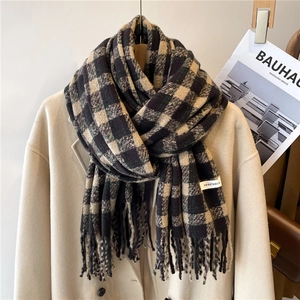 Detail of checkered cashmere-feel scarf with tassel edge and VEGETABLE brand label