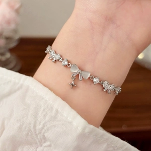 Elegant bow knot cat eye stone bracelet with zircon inlay for women in silver finish
