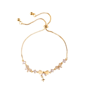 Elegant gold-plated cat eye stone bow bracelet with zircon accents and adjustable sliding clasp