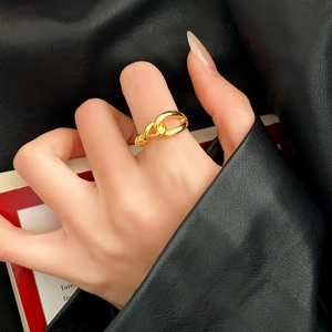 Minimalist gold knot chain ring for women featuring a sleek intertwined metallic design