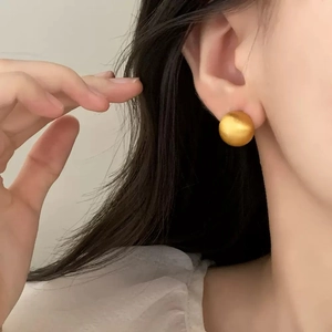 Minimalist matte gold ball stud earrings for women with a brushed metallic texture finish