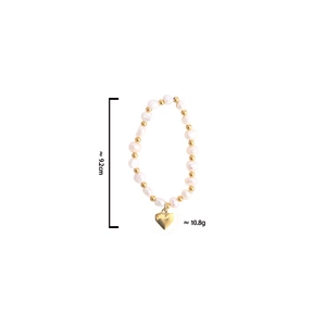 Detailed view of pearl bracelet with gold heart charm weighing 10.8g and measuring 9.2cm