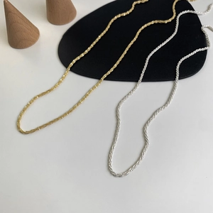 Elegant geometric chain necklaces in gold and silver finish with sparkling woven texture
