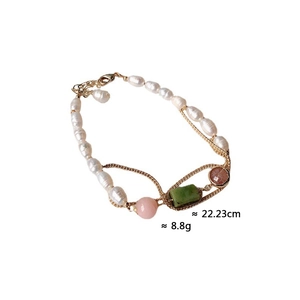 Detailed view of handmade pearl bracelet with gemstones and gold chain, 22.23cm length
