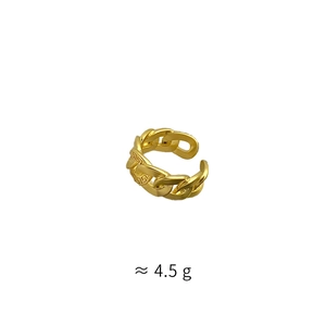 Detail of gold woven chain ring with engraved pattern and adjustable open band