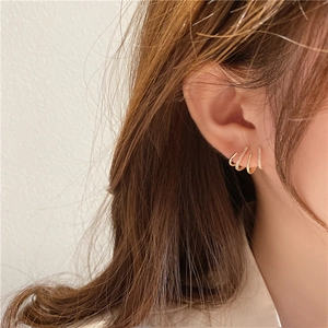 Close-up of four-row gold plated ear cuff with pavé cubic zirconia on model