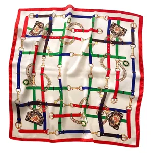 Elegant silk scarf with colorful chain and belt print patterns and a bold red border