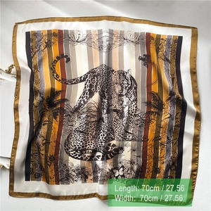 Silk-like square scarf featuring leopard and tropical prints with 70cm x 70cm dimensions