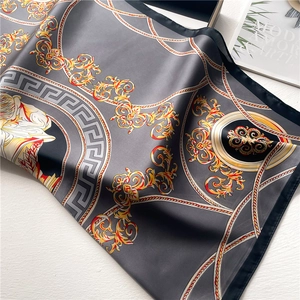 Detailed macro view of baroque pattern scarf with greek meander and satin finish