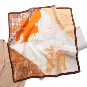 Silk-like square scarf with floral art print and geometric color blocking in orange