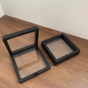 Detail of square black PE film jewelry display boxes for earrings and rings