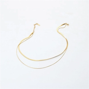 Minimalist double-layer gold snake chain necklace in stainless steel on white background