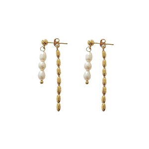 Elegant asymmetrical gold plated earrings with white pearls and long beaded tassels