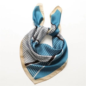 Detail of blue and beige geometric pattern square scarf with silk texture