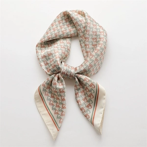 Satin horse print square scarf with orange and green equestrian patterns on beige fabric