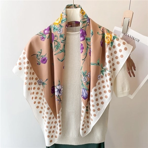 Floral silk scarf with polka dot patterns on a model, elegant 90x90cm beige shawl