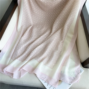 Detailed texture of pink and white scarf with retro chain pattern on soft fabric