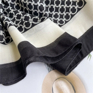Detailed close-up of breathable cotton linen scarf featuring geometric chain patterns