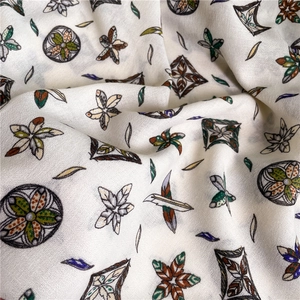 Detail of bohemian floral print cotton-linen scarf with retro pattern and soft texture