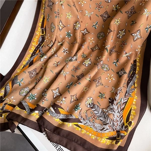 Close-up of vintage brown cotton-linen shawl with elegant floral and geometric patterns