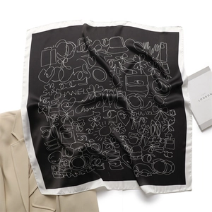 Detailed pattern of a luxury silk square scarf with classic black and white contrast