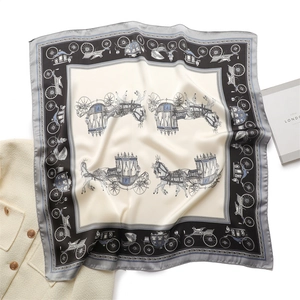 Detail of luxury square silk scarf with horse carriage pattern on tweed jacket background