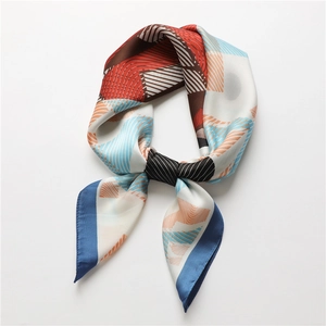 Modern geometric print silk scarf for women featuring brick red and blue pattern design
