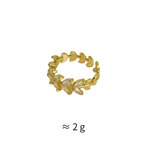 Macro shot of gold leaf ring with zircon inlay showing ≈ 2g lightweight parameter