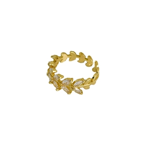 Exquisite gold leaf ring with zircon marquise stones in a minimalist branch design