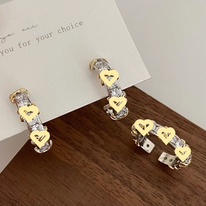 Elegant silver ring and earrings set with zircon stones and yellow heart details