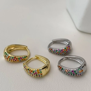 Minimalist gold and silver geometric hoop earrings with colorful pave set cubic zirconia