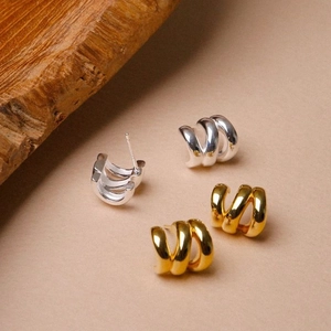 Minimalist multi-layer gold and silver plated metal hoop earrings in triple loop design