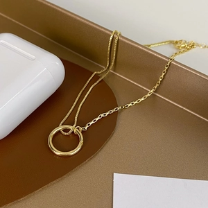 Elegant gold-plated clavicle chain necklace with dual-style links and a polished circle pendant