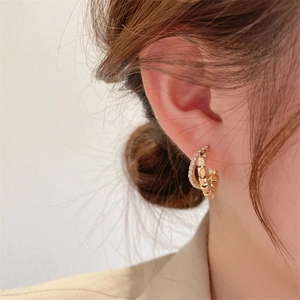 Elegant double-layered C-shaped hoop earrings with sparkling crystals in gold plating