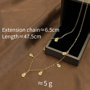Detail view of gold-plated coffee bean necklace showing length 47.5cm and 6.5cm extension chain
