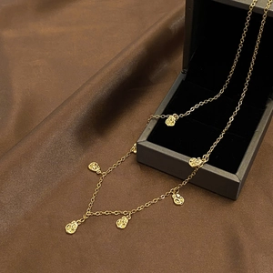 Elegant gold-plated coffee bean link necklace displayed on a luxury jewelry gift box