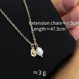 Detail of natural freshwater pearl necklace with hammered gold pendant showing dimensions