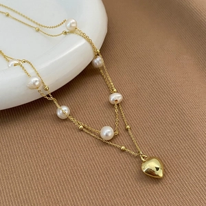 Double-layer gold necklace with freshwater pearls and a solid 3D heart-shaped pendant