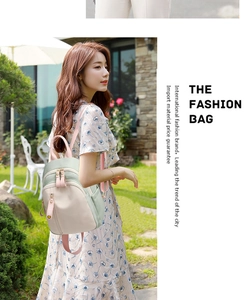 Detail of color-block oxford fabric backpack with side pocket in sunny garden setting