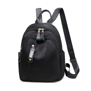 Mini black nylon backpack with FIDM letter strap and large storage capacity