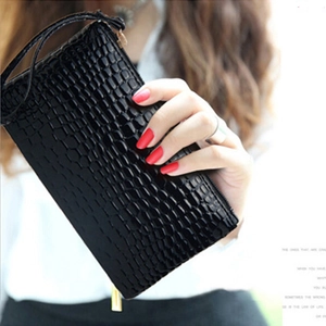 Elegant black crocodile texture clutch bag with gold zipper and wrist strap for women