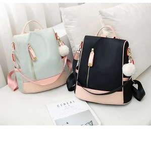 Detail of candy color waterproof oxford backpacks with plush ball and FIDM ribbon