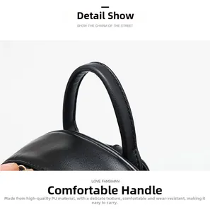Détail de la poignée confortable en cuir PU noir avec coutures fines sur le sac à dos